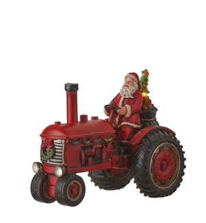 Santa on tractor red battery operated - 11.25x6x8.75"