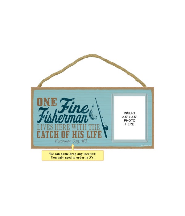 One fine fisherman lives here with the catch of his life (fishing rod image)