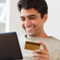 Man online shopping with credit card
