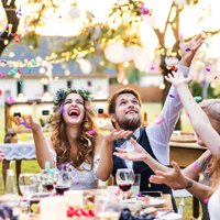 Couple celebrating with confetti during wedding reception 